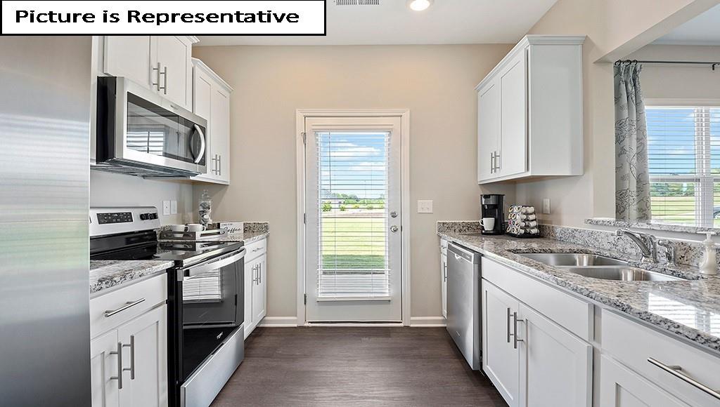 7022 North Mill Road Charlotte, NC 28216 - Photo 11 of 26 a kitchen with stainless steel appliances granite countertop a sink stove and cabinets