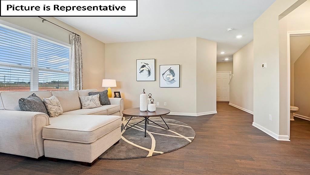 7022 North Mill Road Charlotte, NC 28216 - Photo 6 of 26 a living room with furniture and a window