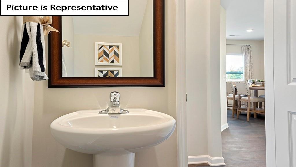 7022 North Mill Road Charlotte, NC 28216 - Photo 10 of 26 a bathroom with a sink and a mirror