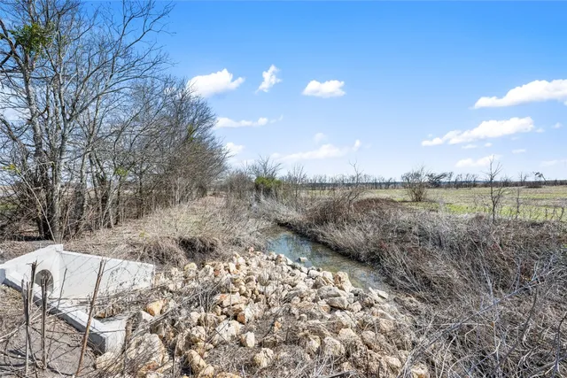 a view of a lake with outside of house