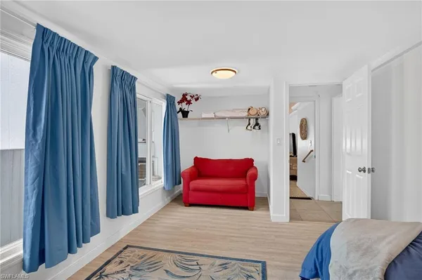a bedroom with a bed and a couch