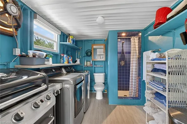 a kitchen with a stove and a bookshelf