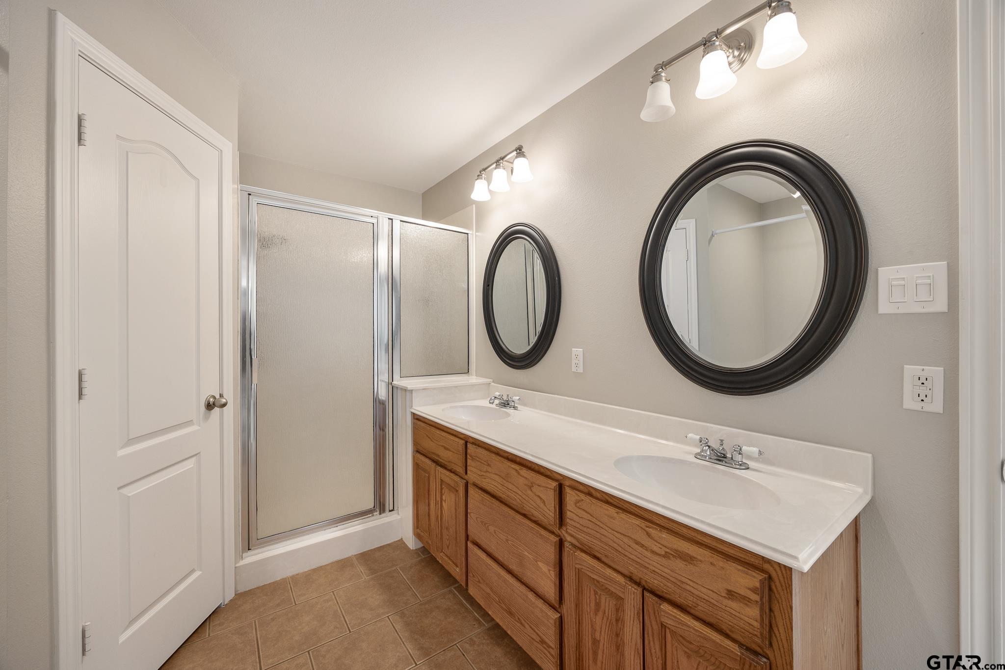 21237 Altuda Lane Flint, TX 75762 - Photo 22 of 48 a bathroom with a sink and a mirror