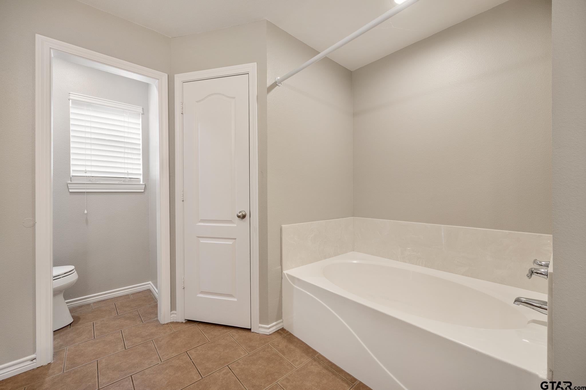 21237 Altuda Lane Flint, TX 75762 - Photo 23 of 48 a white bath tub sitting next to a toilet