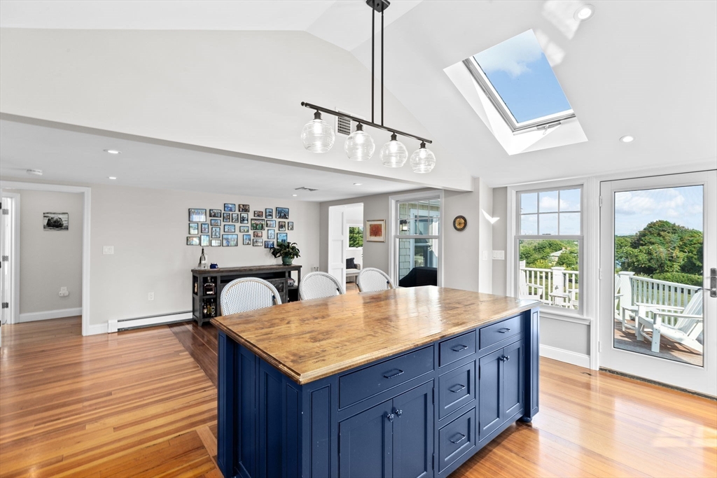 35 Ely Avenue Scituate, MA 02066 - Photo 13 of 33 a view of kitchen island wooden floor living room