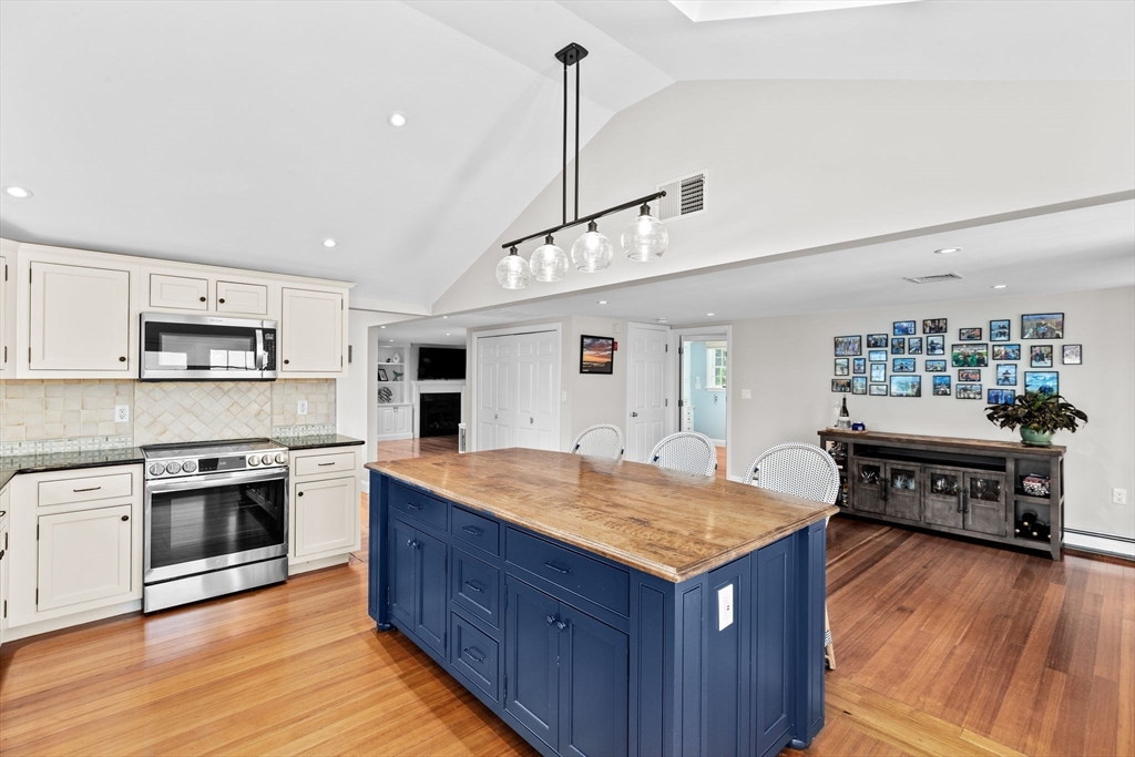 35 Ely Avenue Scituate, MA 02066 - Photo 14 of 33 a kitchen with a stove sink and cabinets