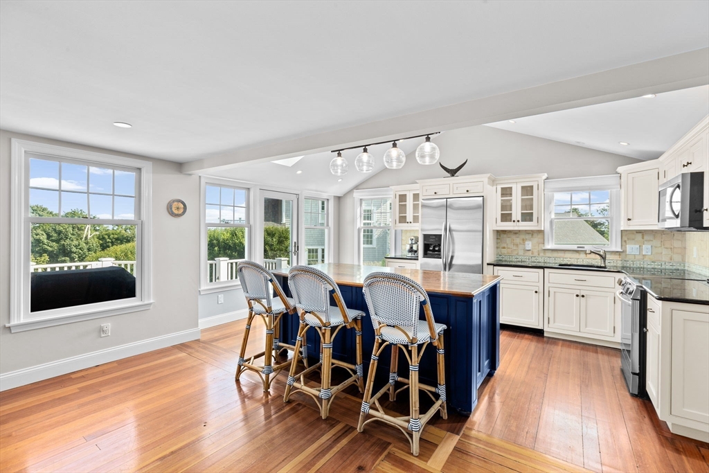 35 Ely Avenue Scituate, MA 02066 - Photo 16 of 33 a view of a dining room with furniture window and wooden floor