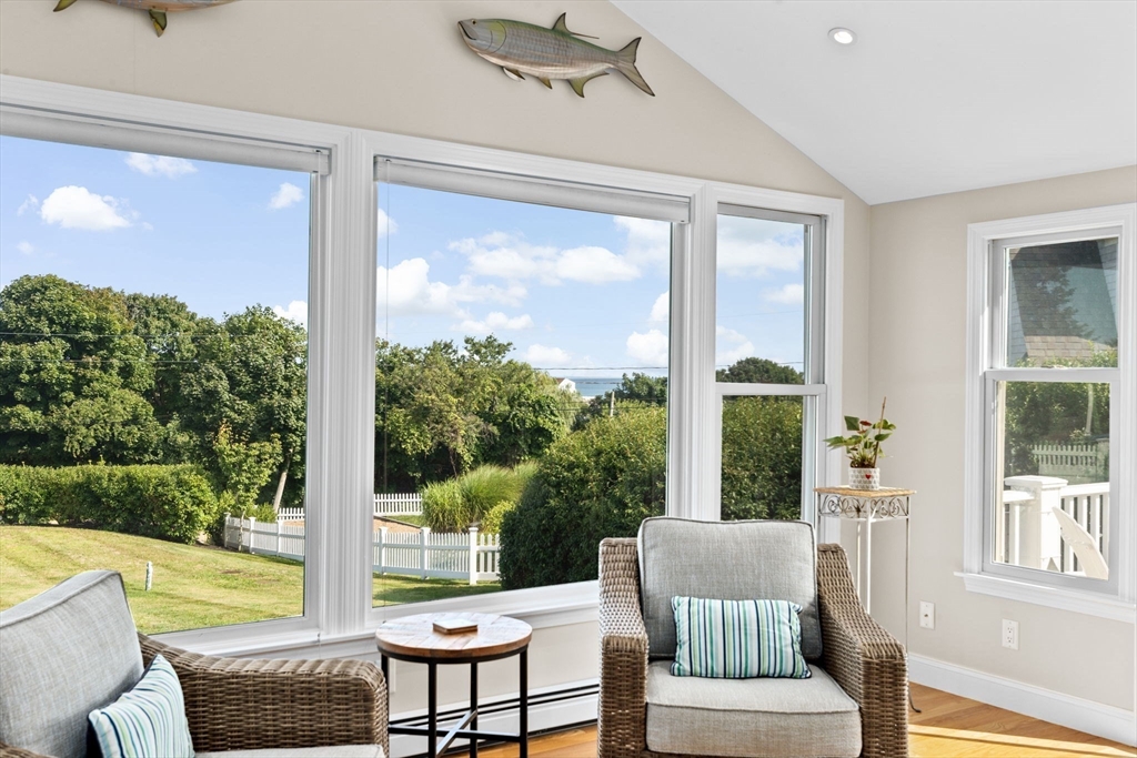 35 Ely Avenue Scituate, MA 02066 - Photo 19 of 33 a living room with furniture and a floor to ceiling window