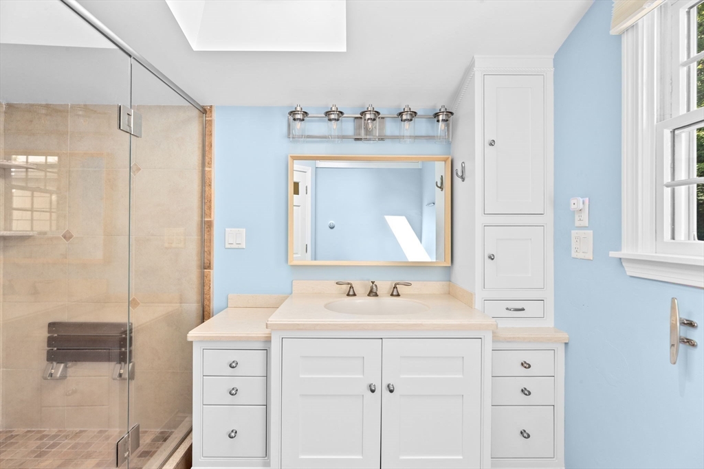 35 Ely Avenue Scituate, MA 02066 - Photo 24 of 33 a bathroom with a sink vanity and mirror