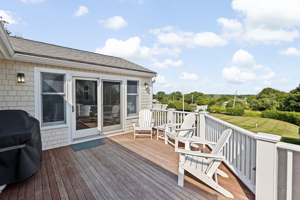 35 Ely Avenue Scituate, MA 02066 - Photo 25 of 33 a view of a balcony with wooden floor and iron stairs