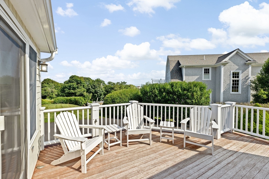35 Ely Avenue Scituate, MA 02066 - Photo 27 of 33 a view of a chair and tables on the roof deck
