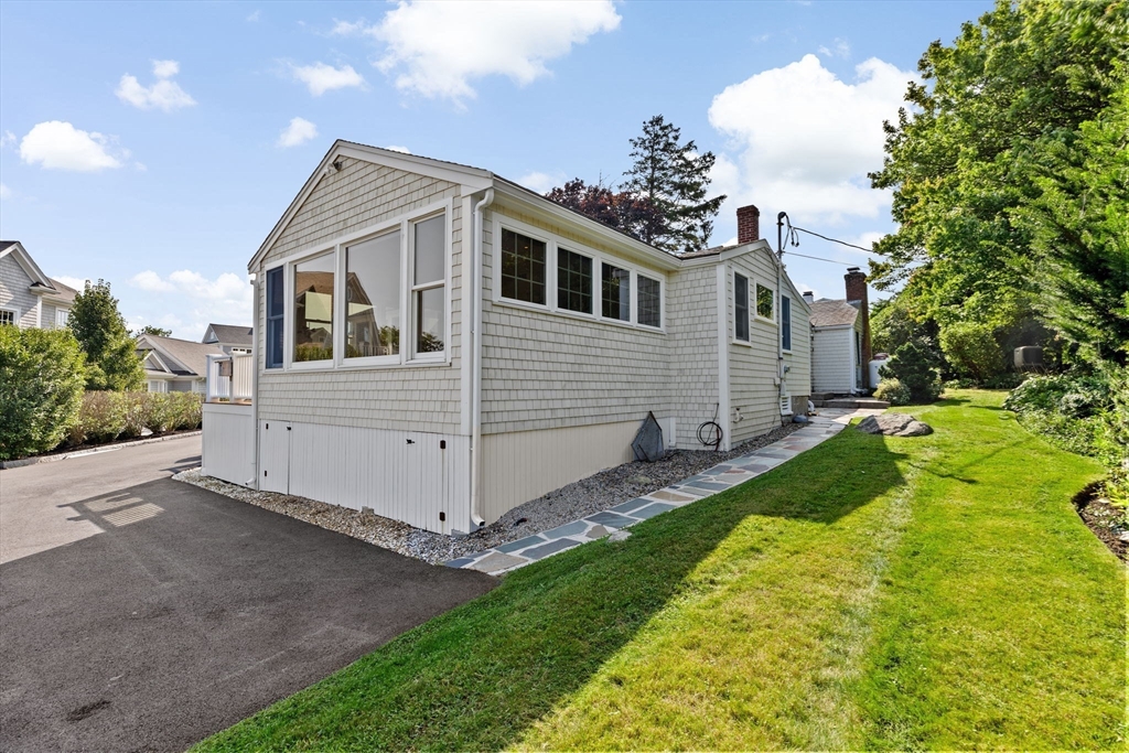 35 Ely Avenue Scituate, MA 02066 - Photo 28 of 33 a front view of a house with garden