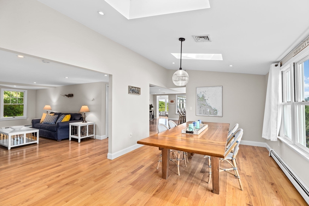 35 Ely Avenue Scituate, MA 02066 - Photo 6 of 33 a living room with furniture dining table and wooden floor