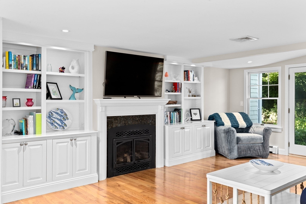 35 Ely Avenue Scituate, MA 02066 - Photo 9 of 33 a living room with furniture fireplace and flat screen tv