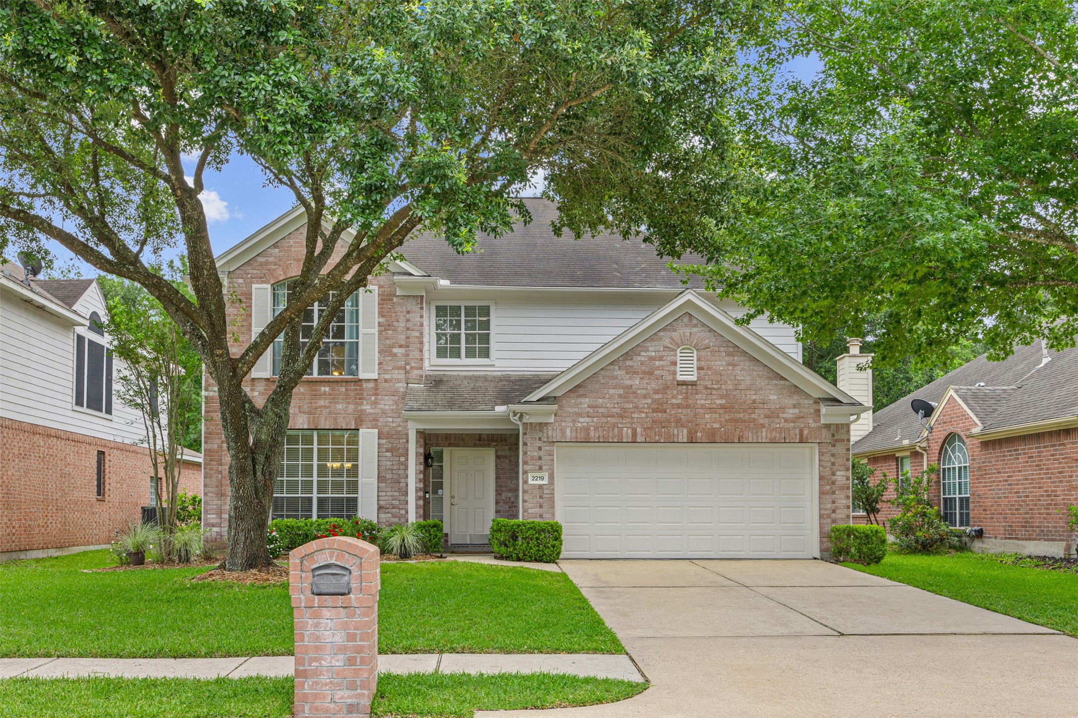 2219 Louetta Brook Lane Spring, TX 77388 - Photo 2 of 34 Well-maintained exterior with lush landscaping and a spacious front yard in a quiet, established neighborhood