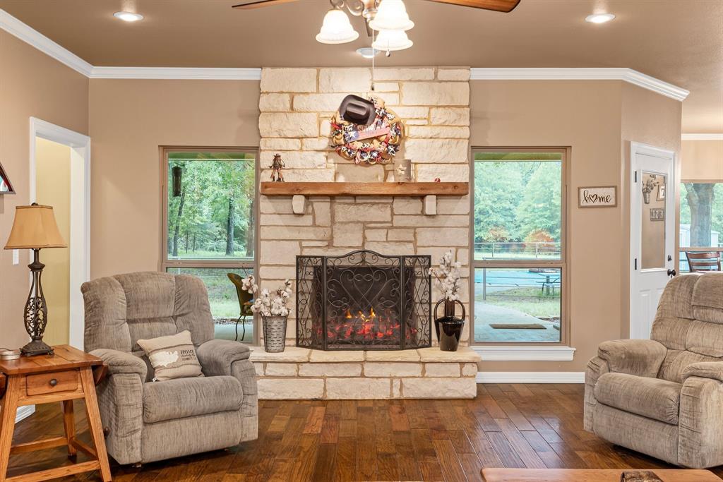 690 County Road Paris, TX 75462 - Photo 11 of 40 a living room with furniture and a fireplace