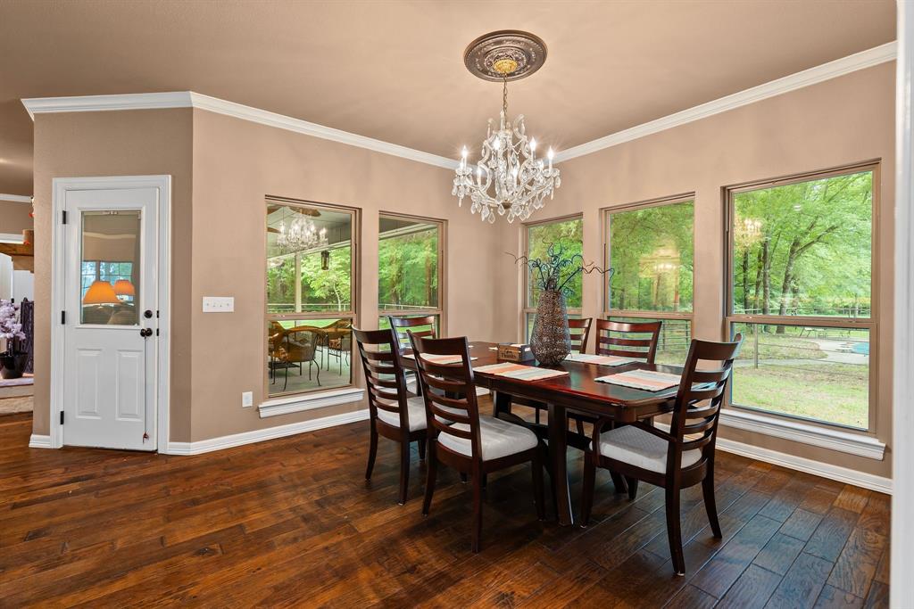 690 County Road Paris, TX 75462 - Photo 15 of 40 a view of a dining room with furniture window and wooden floor