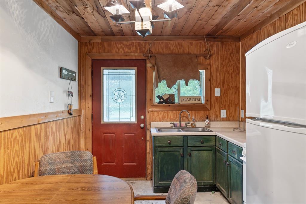 690 County Road Paris, TX 75462 - Photo 30 of 40 a bathroom with a sink and a mirror