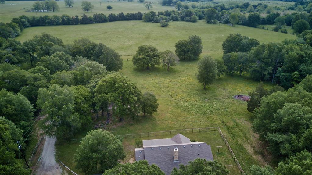 690 County Road Paris, TX 75462 - Photo 38 of 40 an aerial view of a house with a yard