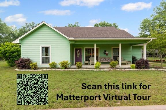 690 County Road Paris, TX 75462 - Photo 39 of 40 a view of a house with a yard