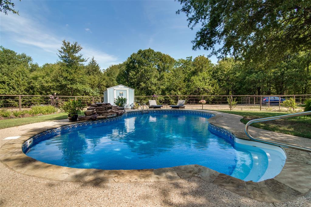 690 County Road Paris, TX 75462 - Photo 7 of 40 a view of a swimming pool with an outdoor space