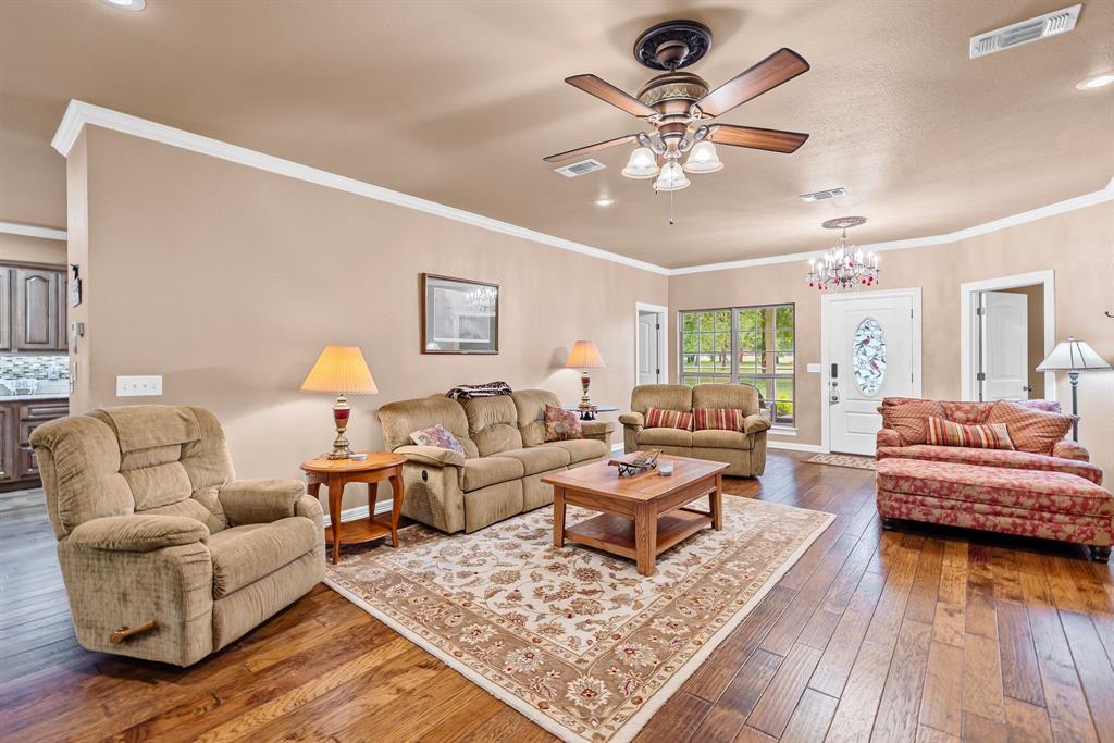 690 County Road Paris, TX 75462 - Photo 9 of 40 a living room with furniture and wooden floor