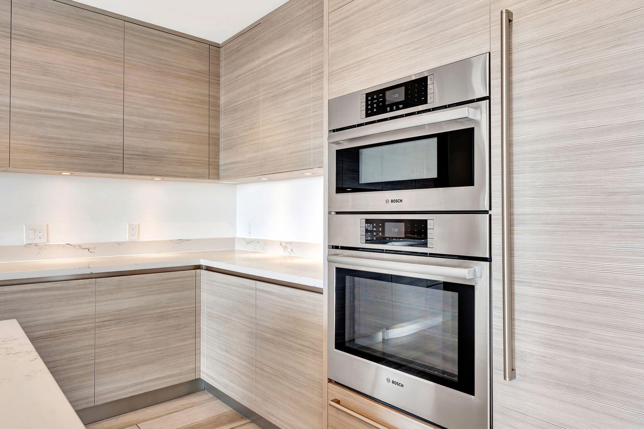 155 East Boca Raton Road, Unit 719 Boca Raton, FL 33432 - Photo 18 of 102 a kitchen with granite countertop cabinets stainless steel appliances and counter space