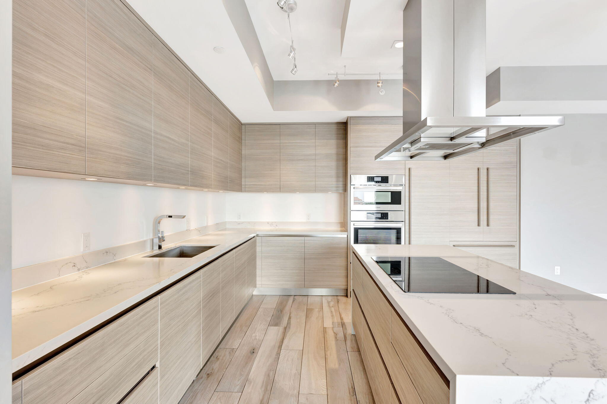 155 East Boca Raton Road, Unit 719 Boca Raton, FL 33432 - Photo 19 of 102 a kitchen with stainless steel appliances granite countertop a sink and dishwasher a stove with wooden floors