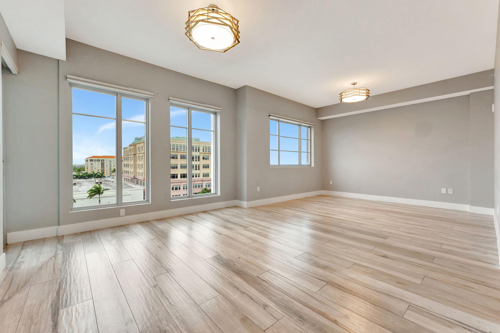 155 East Boca Raton Road, Unit 719 Boca Raton, FL 33432 - Photo 24 of 102 an empty room with wooden floor and windows