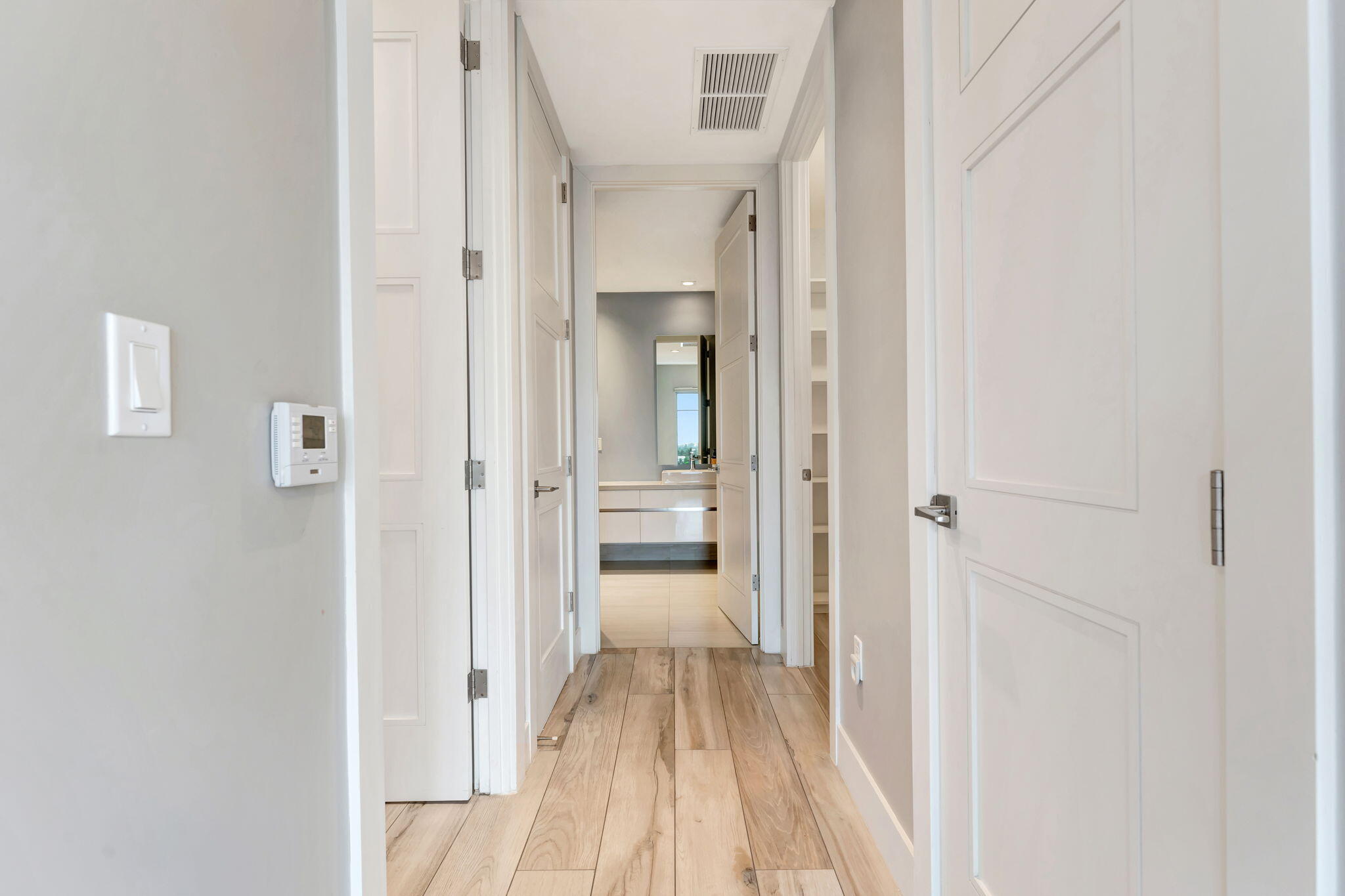 155 East Boca Raton Road, Unit 719 Boca Raton, FL 33432 - Photo 31 of 102 a view of a bedroom with wooden floor and a bathroom