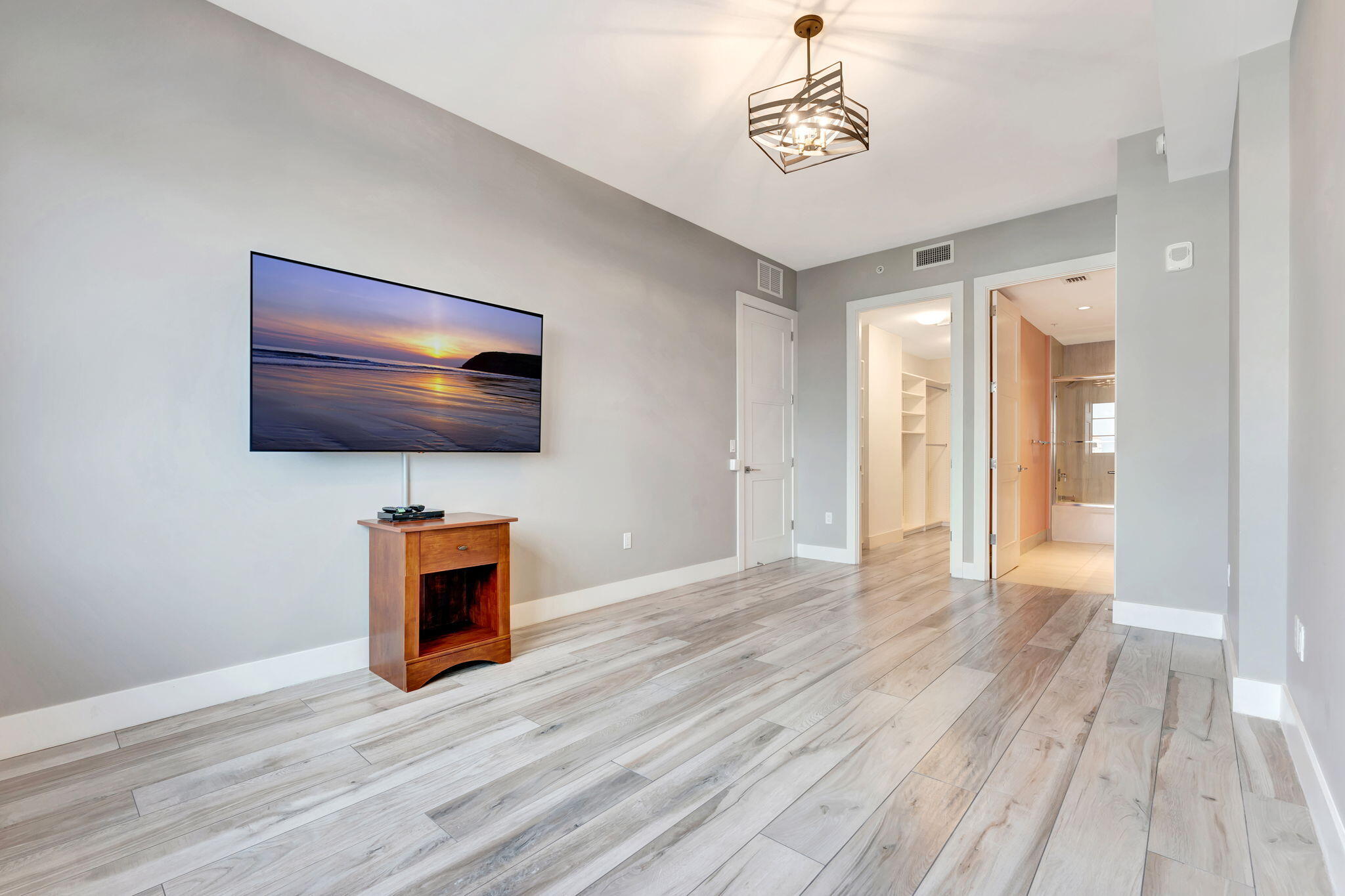 155 East Boca Raton Road, Unit 719 Boca Raton, FL 33432 - Photo 40 of 102 a view of a livingroom with wooden floor and a kitchen space