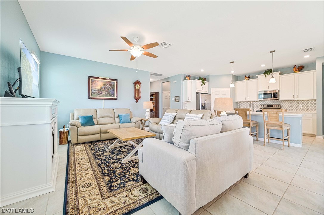 3435 Gold Flower Street Fort Myers, FL 33905 - Photo 15 of 39 a living room with furniture and a table