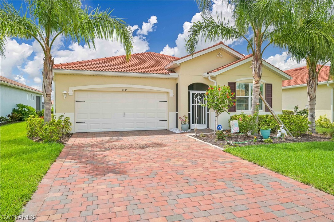 3435 Gold Flower Street Fort Myers, FL 33905 - Photo 2 of 39 a front view of house with yard and green space
