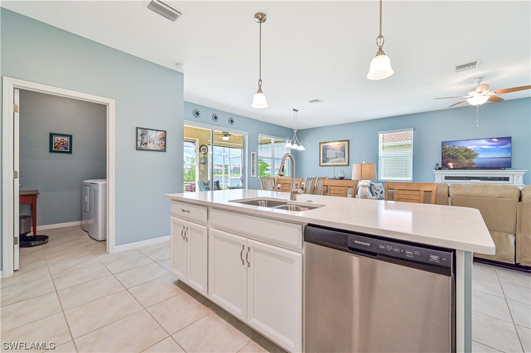3435 Gold Flower Street Fort Myers, FL 33905 - Photo 23 of 39 a kitchen with center island table and chairs