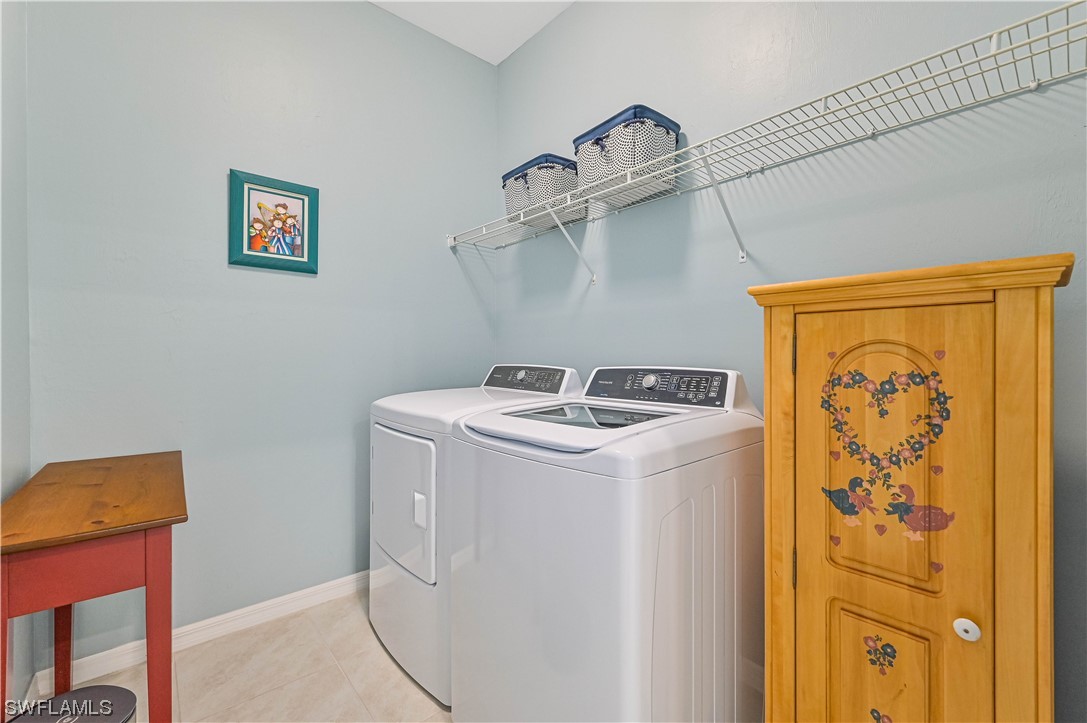 3435 Gold Flower Street Fort Myers, FL 33905 - Photo 24 of 39 a utility room with dryer and washer