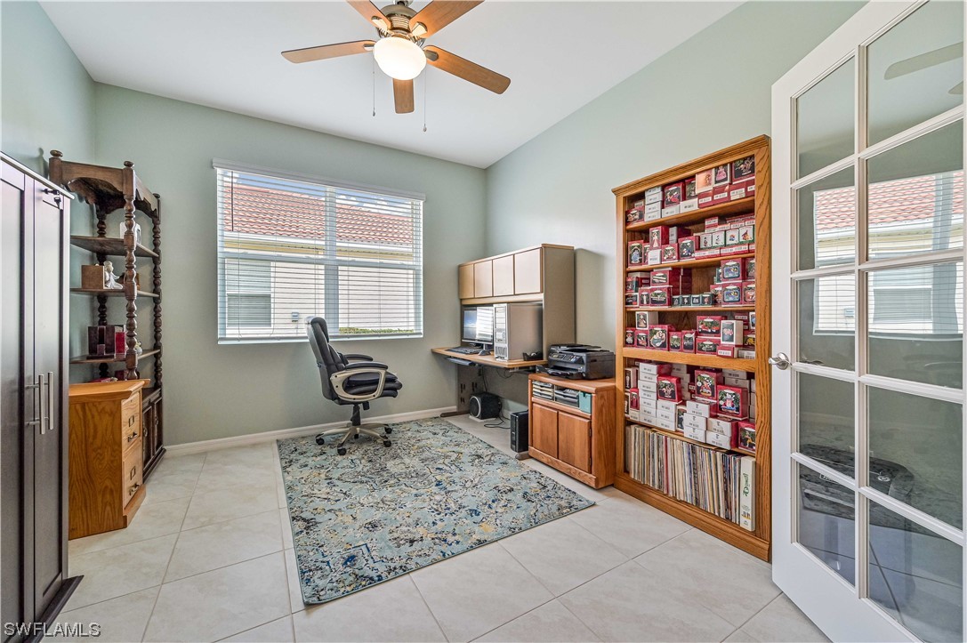 3435 Gold Flower Street Fort Myers, FL 33905 - Photo 30 of 39 a living room with furniture a window and a flat screen tv