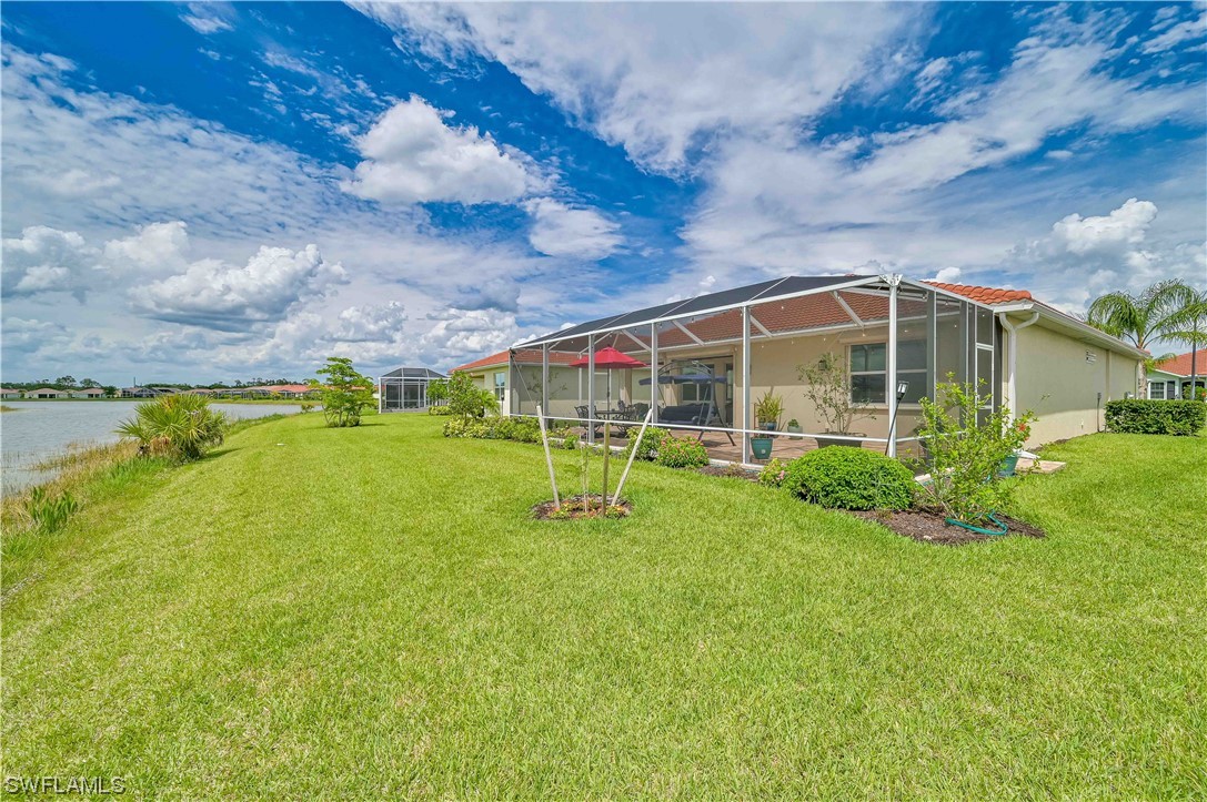 3435 Gold Flower Street Fort Myers, FL 33905 - Photo 3 of 39 a view of a house with a backyard