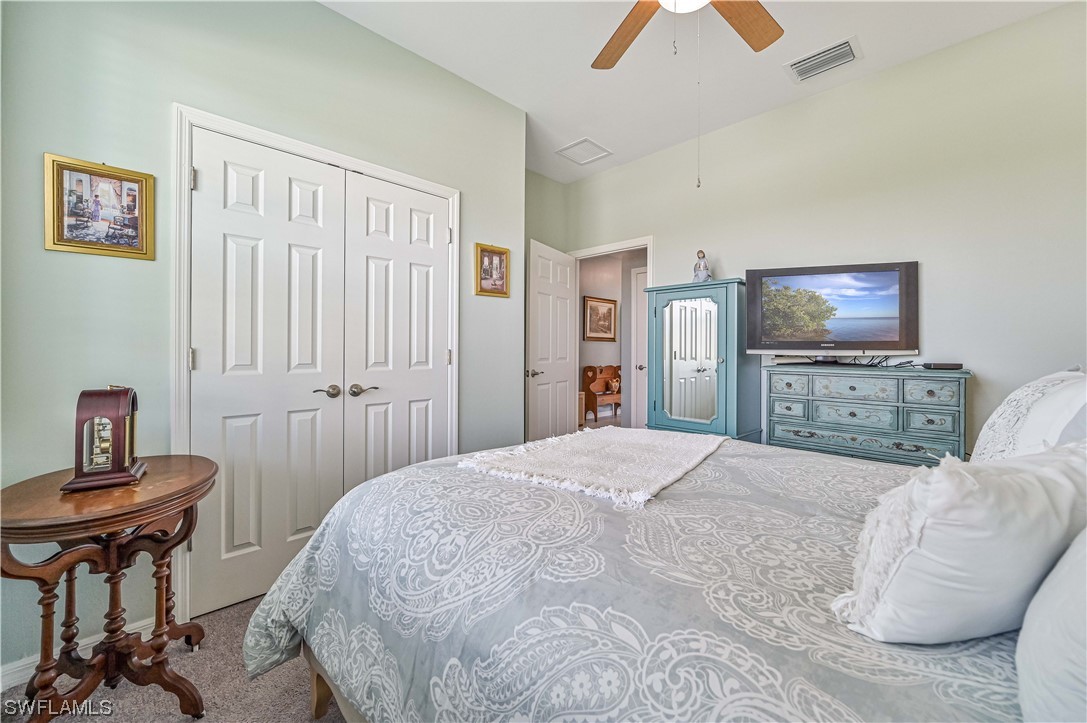3435 Gold Flower Street Fort Myers, FL 33905 - Photo 33 of 39 a bedroom with a bed and a television