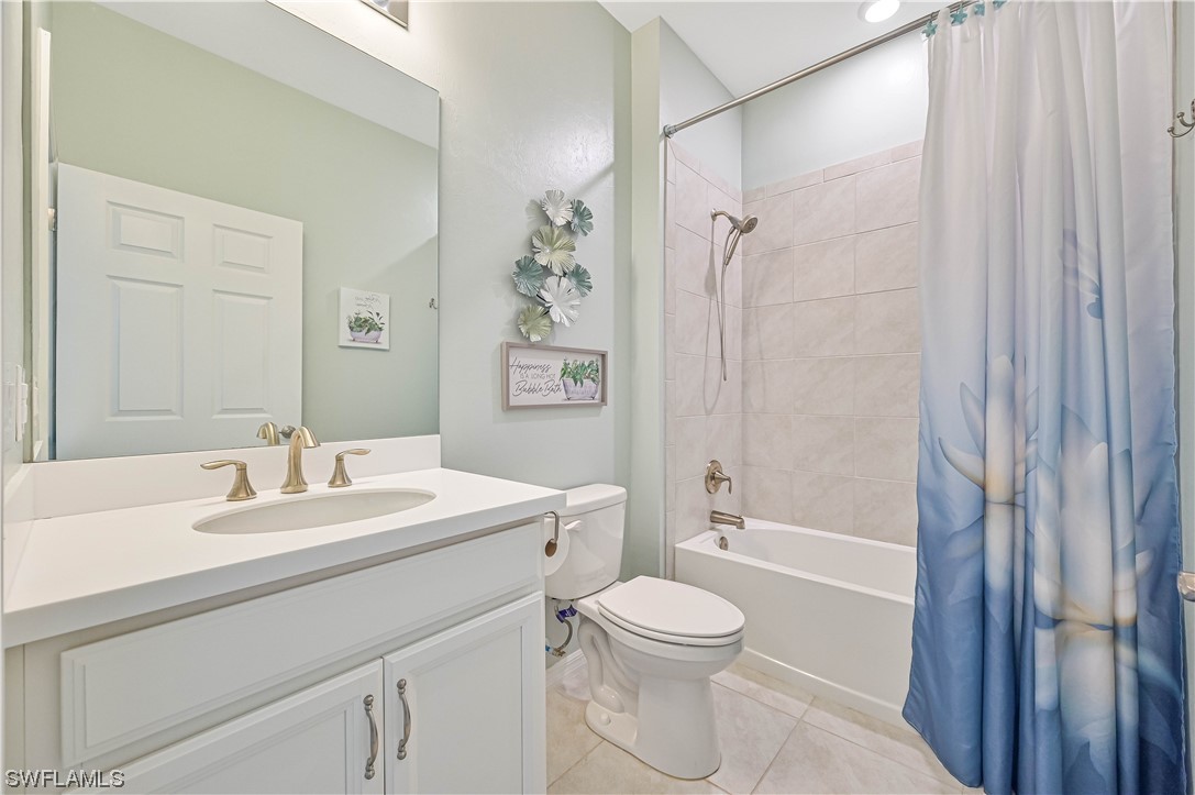 3435 Gold Flower Street Fort Myers, FL 33905 - Photo 34 of 39 a bathroom with a sink a toilet and shower