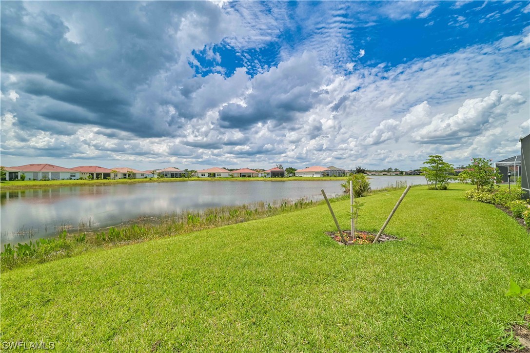 3435 Gold Flower Street Fort Myers, FL 33905 - Photo 4 of 39 a view of a lake with a yard