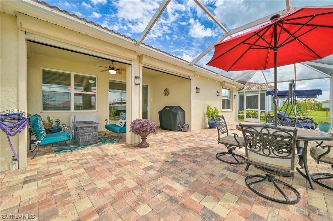 3435 Gold Flower Street Fort Myers, FL 33905 - Photo 5 of 39 a view of a dinning tables and chairs in the patio