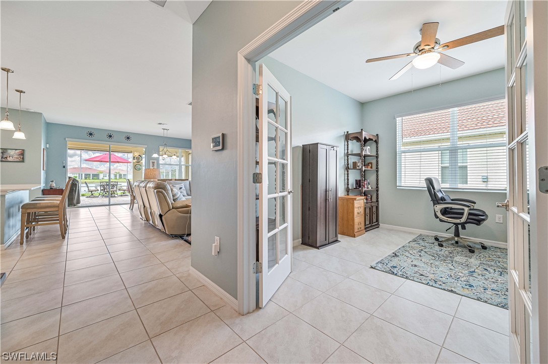 3435 Gold Flower Street Fort Myers, FL 33905 - Photo 10 of 39 a living room with furniture a dining table and chairs