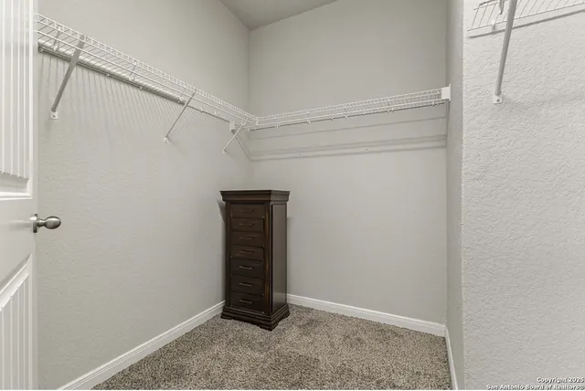 a view of an empty walk in closet
