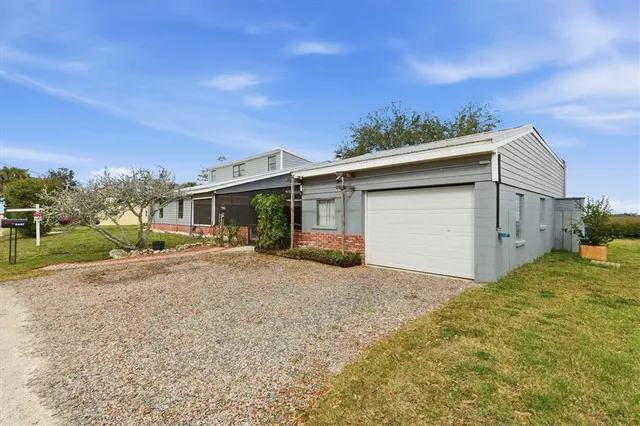 a kitchen with stainless steel appliances a refrigerator sink and microwave