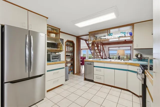 a bedroom with a large bed and a large window