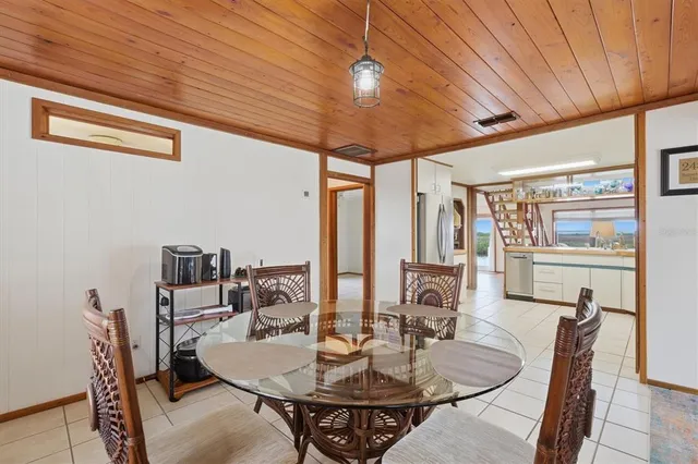 a bedroom with furniture and a flat screen tv