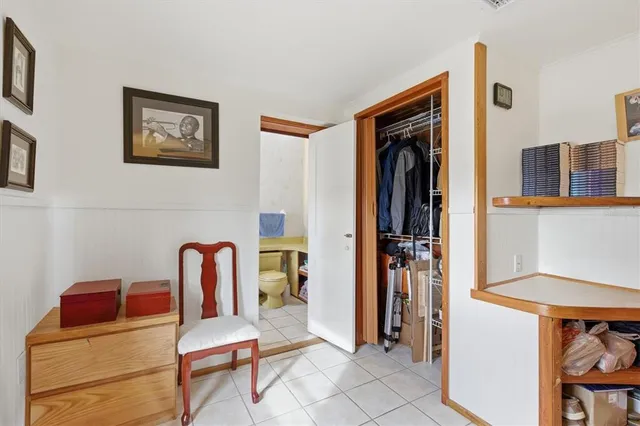 a backyard of a house with a table and chairs