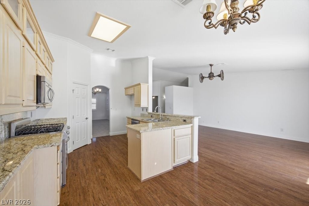 573 Beryl Court Henderson, NV 89015 - Photo 11 of 52 Open kitchen features vaulted ceilings granite countertops and S.S. appliances.