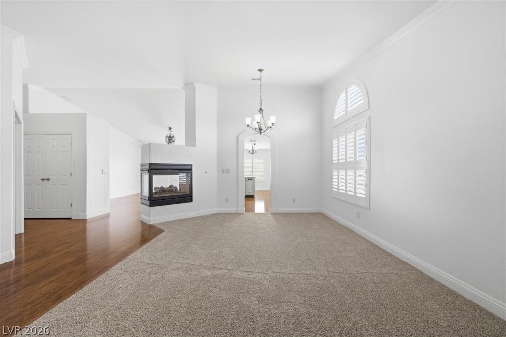 573 Beryl Court Henderson, NV 89015 - Photo 21 of 52 Spacious living room with brand new carpet, Plantation shutters.