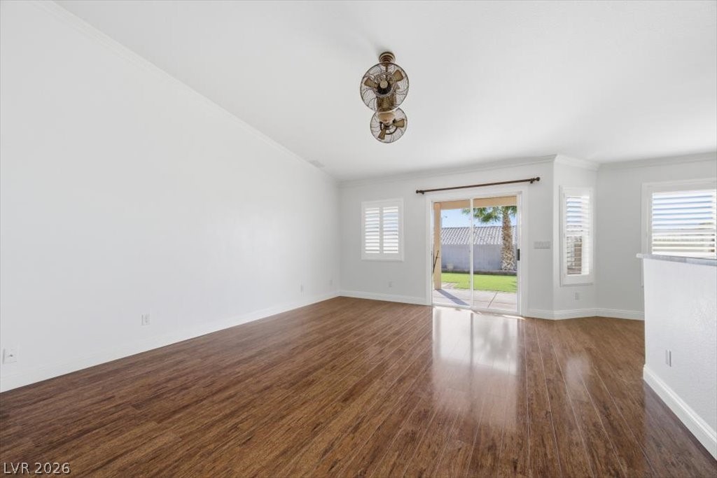 573 Beryl Court Henderson, NV 89015 - Photo 27 of 52 Spacious family room with vaulted ceilings, wood laminate floors and sliding glass door to the backyard.
